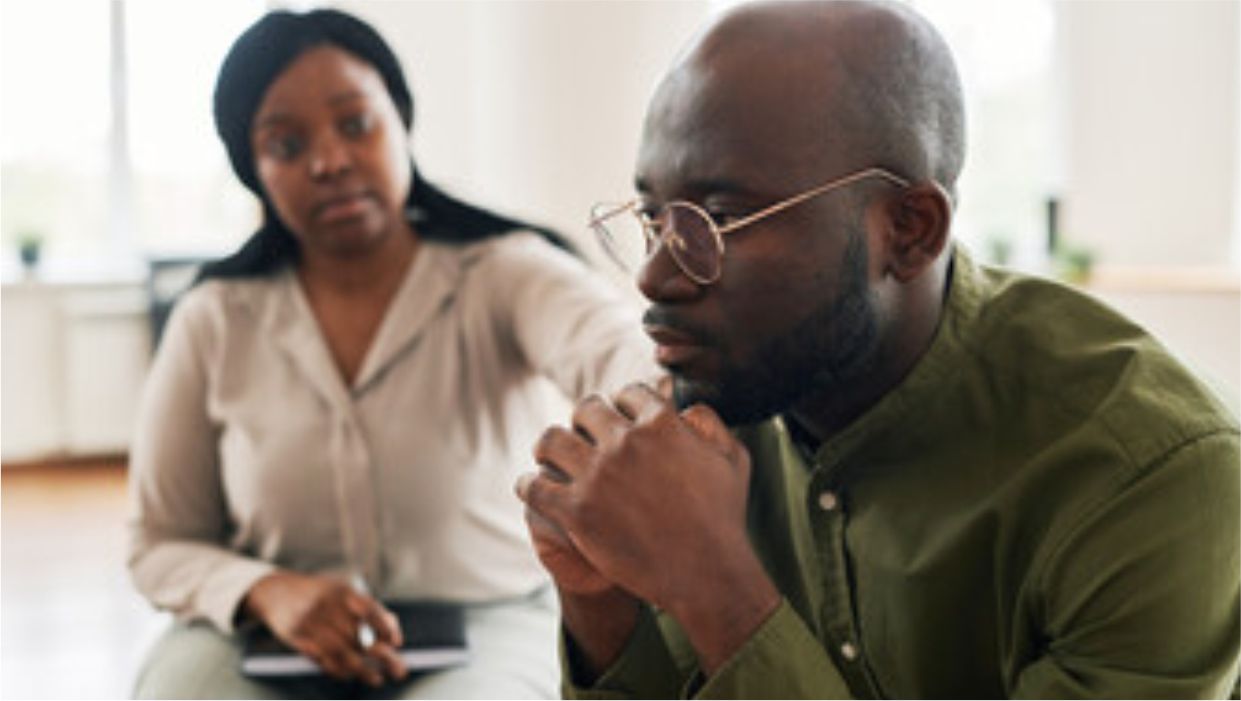 a black man thinking about gambling